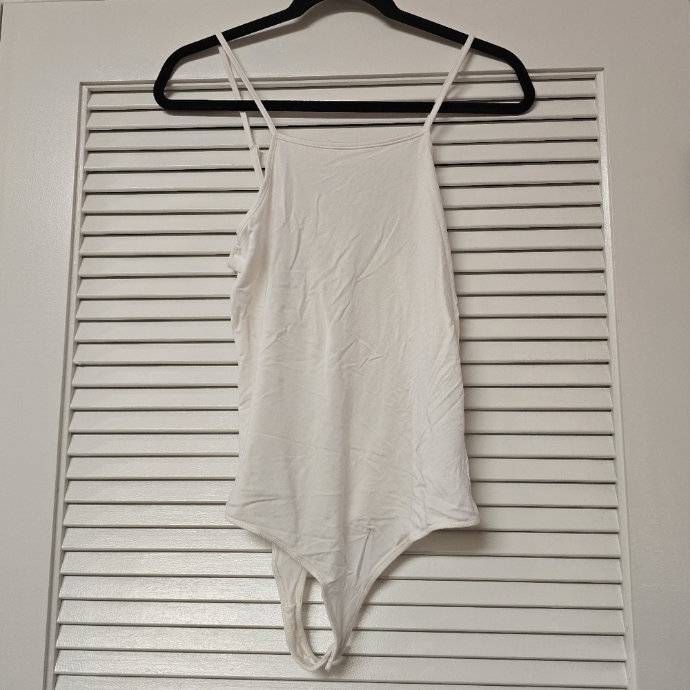 Little Black Bodysuit - White Sleeveless Bodysuit With Snap Enclosure